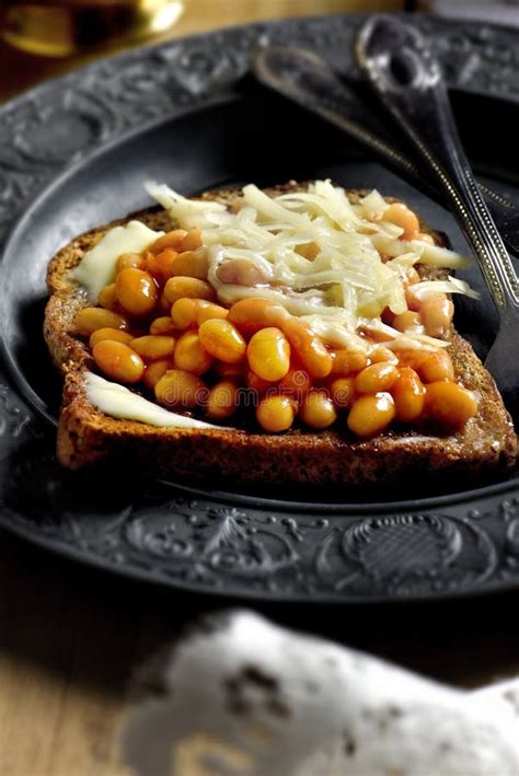 Beans On Toast With Grated Cheddar Cheese Stock Photo - Image of toast ...