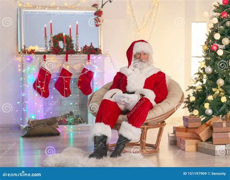 Santa Claus in Living Room Decorated for Christmas Stock Image - Image ...
