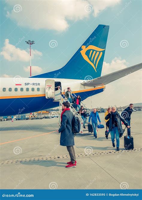 Krakow, Poland - MARCH 10, 2019 Passengers Get Out of the Aircraft