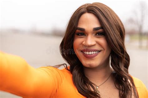 Selfie Of Trans Woman In Orange Clothes Latin Ethnicity City Outdoors