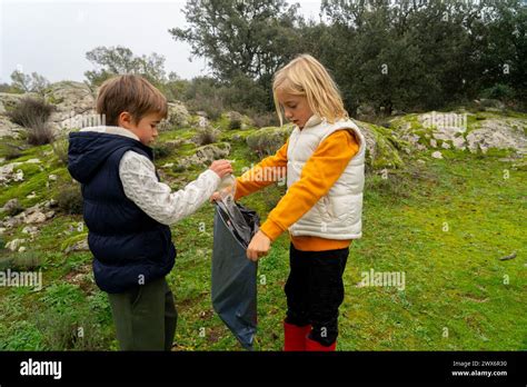 Children Collecting Garbage Hi Res Stock Photography And Images Alamy