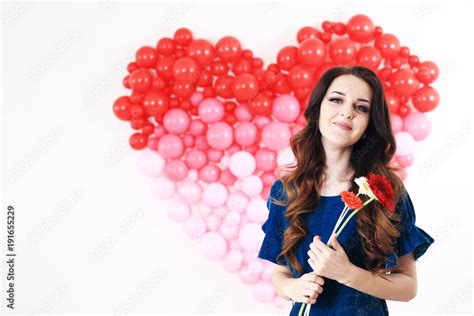 Sexy Brunette Woman With Red Heart Balloons And Flowers Stock Photo Adobe Stock