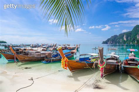 The Thai Traditional Wooden Longtail Boat And Beautiful Beach In Phuket