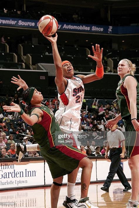 Monique Currie Of The Charlotte Sting Drives To The Basket Against