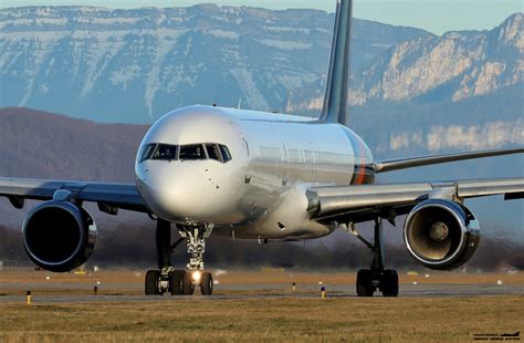 A large jetliner sitting on top of an airport runway photo – Free