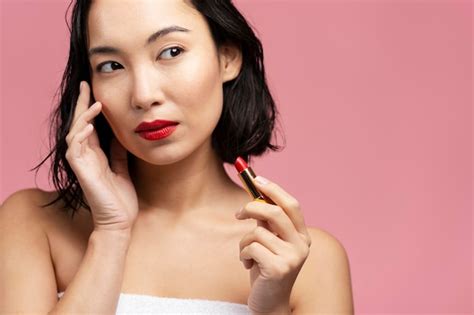 Premium Photo Portrait Of Brunette Asian Woman With Short Hair And Red Lips