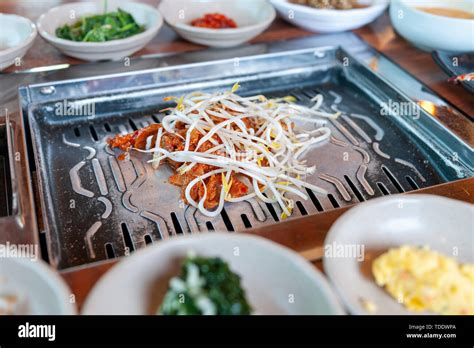 grilled marinated pork kimchi topped  bean sprout eaten