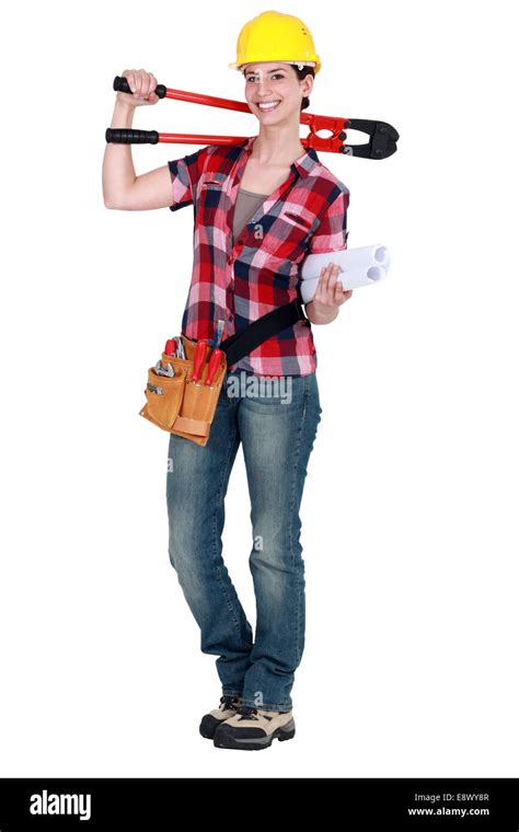 craftswoman holding a spanner Stock Photo - Alamy