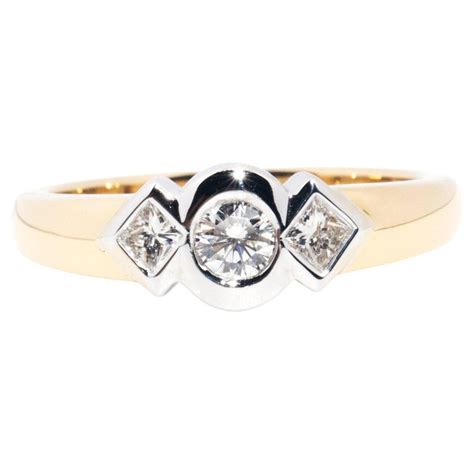 Contemporary 18 Carat Yellow White Gold Rub Over Set Diamond Three Stone Ring For Sale At 1stdibs