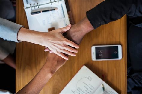 Free Photo | Diverse business team stacking hands 
