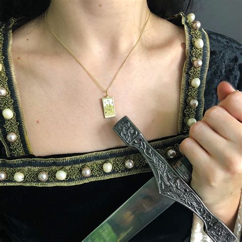 The Queen Of Swords Tarot Charm On A Chain Necklace Gold