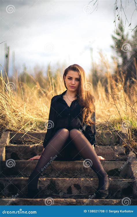 A Beautiful Brunette Girl Sitting On Stairs Autumn Stock Photo Image Of Breast Outside