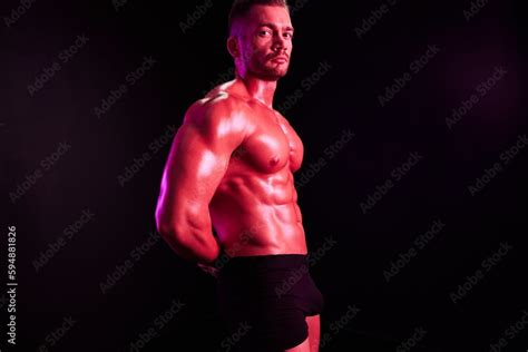 Man Professional Athlete With Naked Torso In Sports Uniform Isolated On Multicolored Background