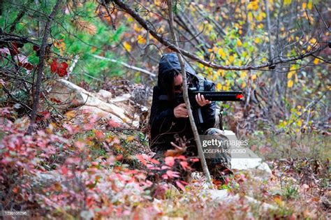 Militia members return fire during an ambush as they practice a two ...