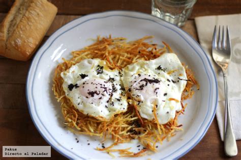 Receta de huevos trufados con guarnición de patatas paja