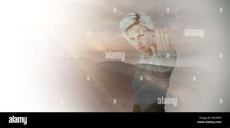 Composite Image Of Angry Pretty Blonde Showing Her Hand Stock Photo Alamy