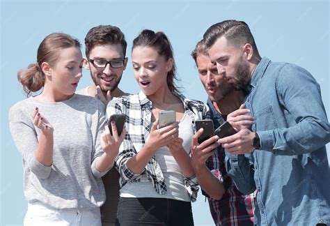 premium photo group  young people  smartphones