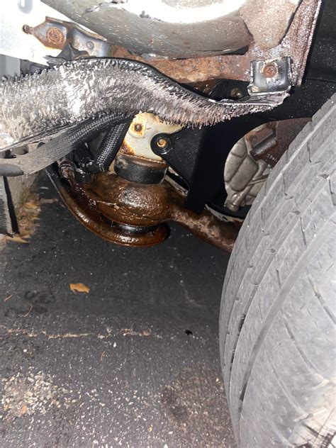 Why is my 2006 toyota highlander hybrid leaking red fluid from the