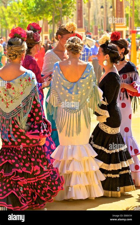 Group Of Women Wearing Traditional Spanish Costume Annual Horse Fair