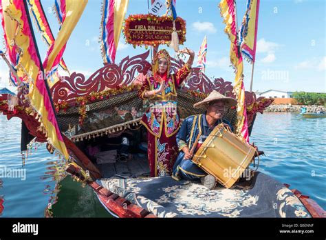 Bajau Lady Dancing On Traditional Boat Called Lepa Lepa Decorated With