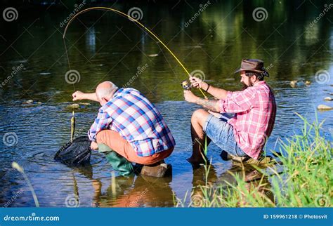 Two Male Friends Fishing Together Retired Father And Mature Bearded Son Happy Fishermen