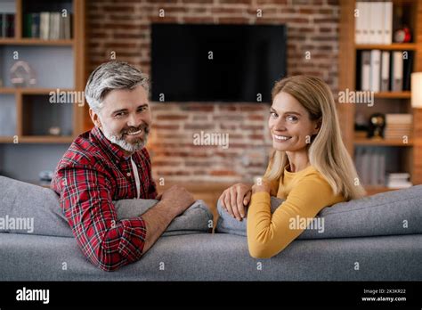 Calm Smiling Mature European Wife And Husband Relaxing Enjoy Free Time