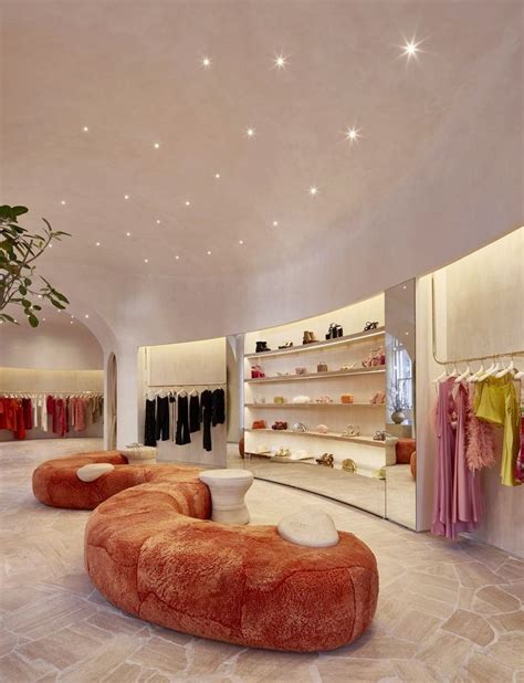 The Inside Of A Clothing Store With An Orange Bean Bag