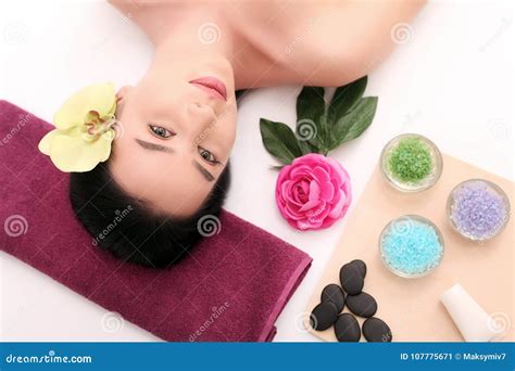 Beautiful Young Woman Receiving Facial Massage In Spa Salon Stock Image