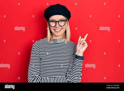 Beautiful Blonde Woman Wearing French Look With Beret An Glasses Smiling Happy Pointing With
