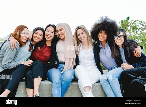 Business Women Group Of Multiethnic People Having Fun Hugging Outside