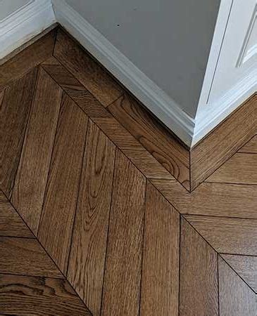 A Single Border With Mitred Corners Finishes Off This Dark Chevron Oak