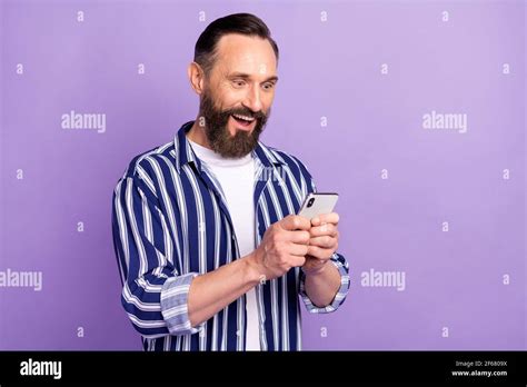 Photo Of Astonished Mature Man Use Smartphone Scream Incredible Social Media Post Isolated Over