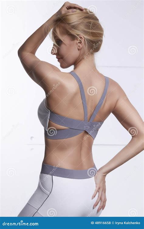 Beautiful Blonde With Perfect Athletic Slim Figure Engaged In Yoga Pilates Exercise Or Fitness