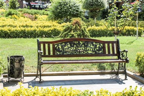 Wooden park bench at a park 14540533 Stock Photo at Vecteezy