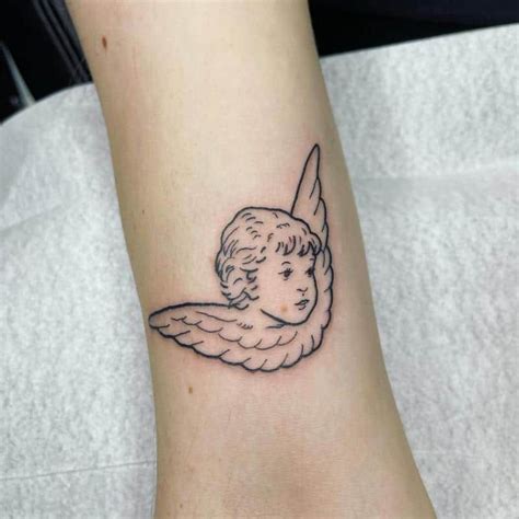 Cherubim Angels Tattoo Cherub Tattoo Designs Cherub Baby Saved