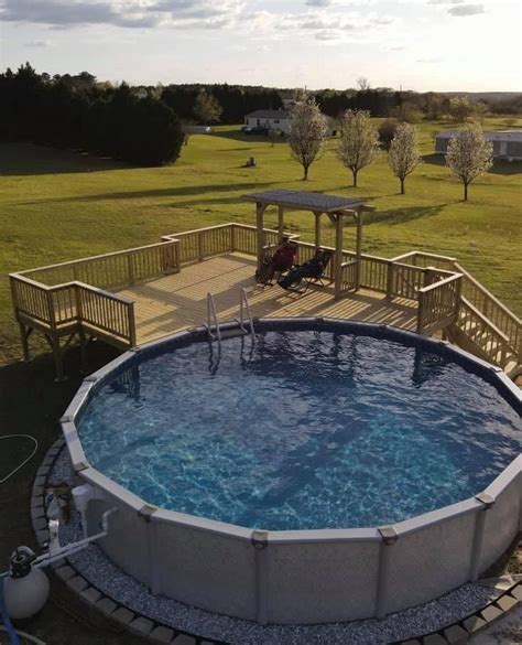 An Above Ground Swimming Pool With Steps Leading Up To It