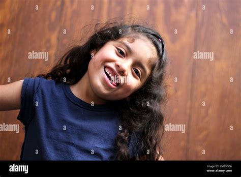 Brunette Latina Girl With Curly Hair Chews Gum That Causes Tooth Decay Irritates Gums Modifies