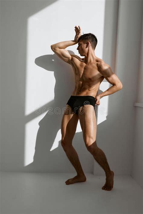 Sporty Man With Pumped Up Naked Body In Black Panties Posing Near The Window Stock Photo Image