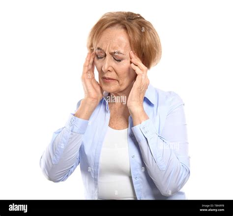 Beautiful Mature Woman Suffering From Head Ache Against White Background Stock Photo Alamy