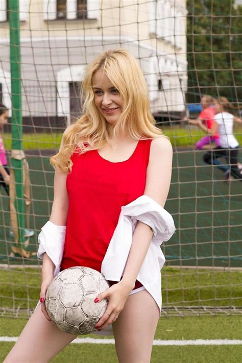 The Blonde In Red Form With A Ball At The Gate On The Football Field 5209225 Stock Photo At