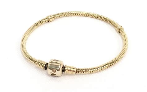 A Pandora 14 Carat Gold 585 7 Charm Bracelet