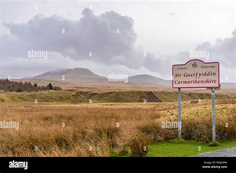 Welcome To Carmarthenshire Sign With Cumulonimbus Clouds Over The