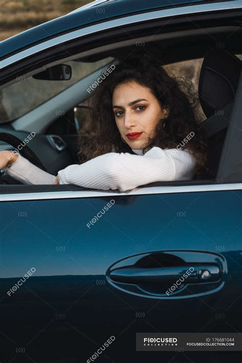 Portrait Of Brunette Woman Siting In Car And Looking At Camera Freedom Leisure Stock Photo