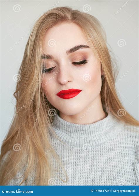 Closeup Natural Light Beauty Portrait Of Blonde Woman Model With Vibrant Saturated Red Lips