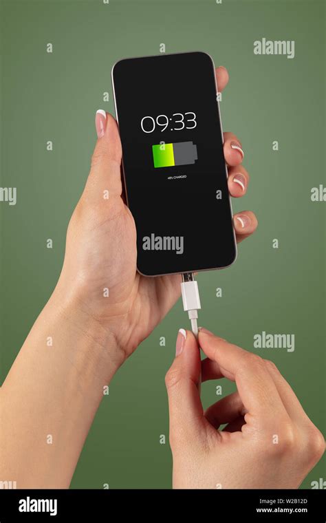 Elegant Hand Charging Smartphone With Low Battery Stock Photo Alamy