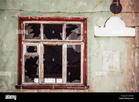 smashed window house  res stock photography  images alamy