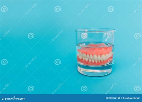 Prosthesis In A Glass With A Solution Dental Prosthesis Care Full