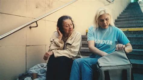 Volunteer Sharing A Hot Meal With Sad Ho Stock Video Pond5