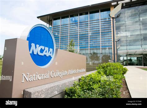 A logo sign outside of the headquarters of the National Collegiate ...