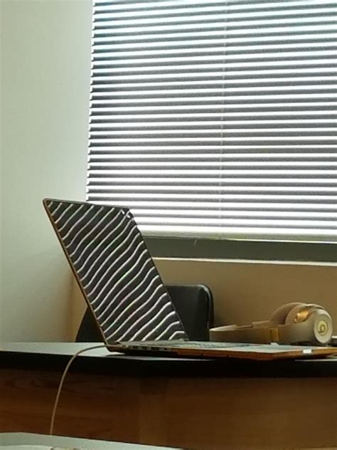 The sun and the blinds combined to hit the screen in a pretty cool way